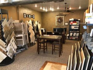 Flooring showroom displaying various tile and wood samples at Carpets By Cal Inc in Vernal, UT
