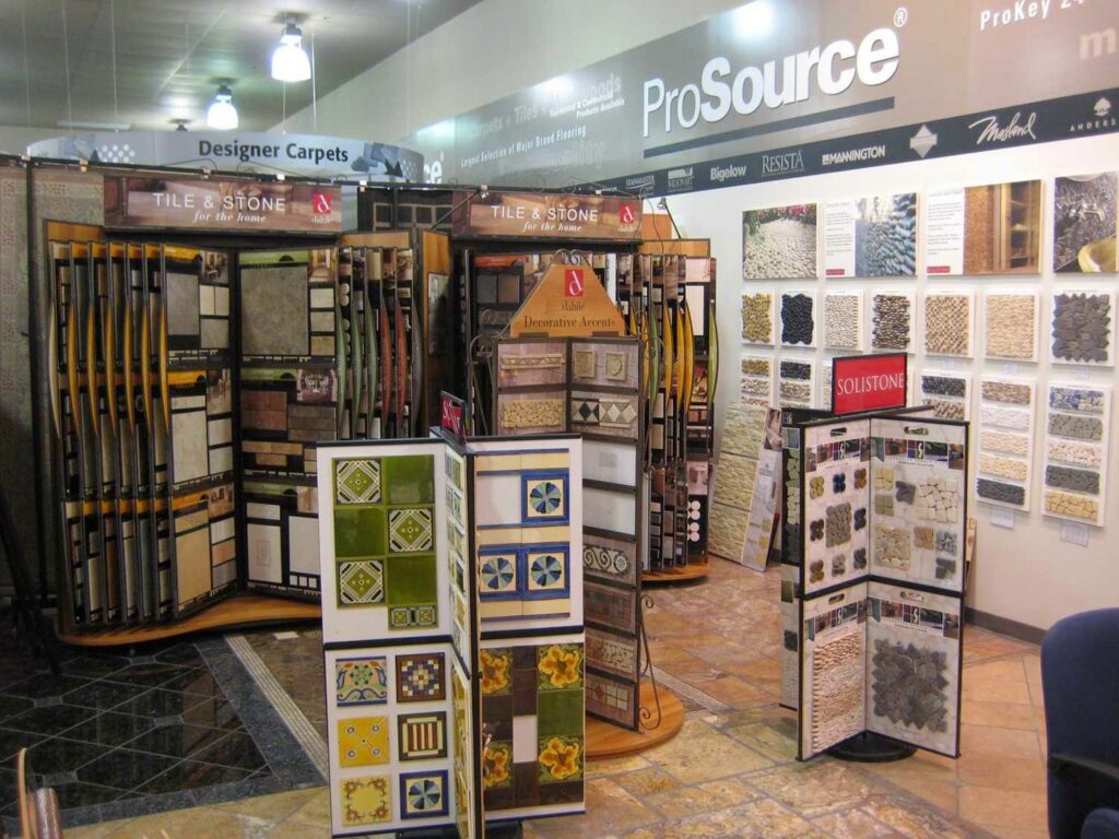 Interior of the ProSource Flooring Kitchen & Bath showroom in Naperville, IL, featuring tile and carpet displays.