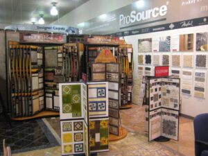 Interior of the ProSource Flooring Kitchen & Bath showroom in Naperville, IL, featuring tile and carpet displays.