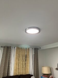 A modern flush-mount ceiling light fixture installed by Mark Anthony Electric LLC in Wilmington, DE