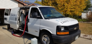 The Foothills Carpet Cleaners service van with hoses extended, ready for a job in Fort Collins, CO.