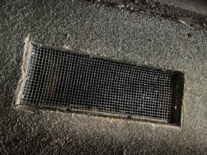 A foundation vent covered with wire mesh for pest exclusion by Ark Pest Management in Anaheim, CA.