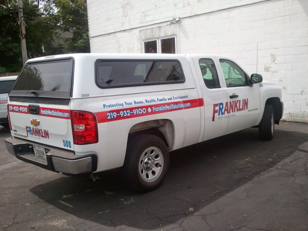 A branded Franklin Pest Solutions service truck parked, ready for pest control jobs in Lafayette, IN.