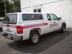 A branded Franklin Pest Solutions service truck parked, ready for pest control jobs in Lafayette, IN.