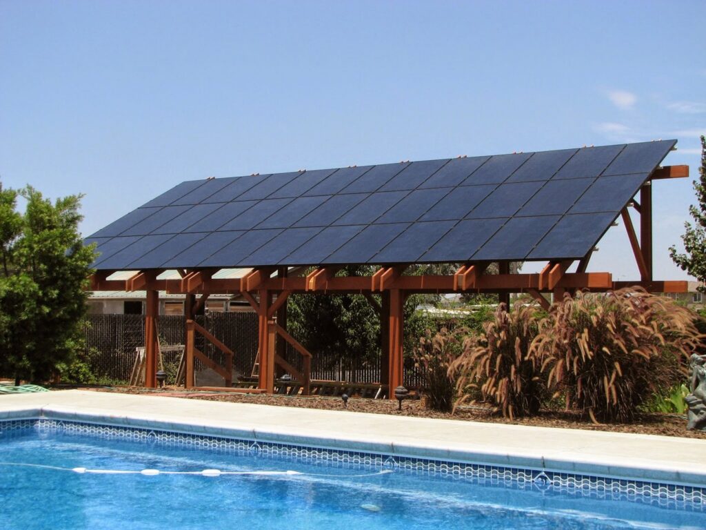 Solar panels installed on a freestanding structure next to a swimming pool by Element Power Systems, Inc. in Brentwood, CA