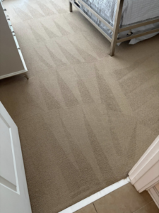 A freshly cleaned bedroom carpet with distinct vacuum lines by Carpet Chemistry in Gulfport, MS.