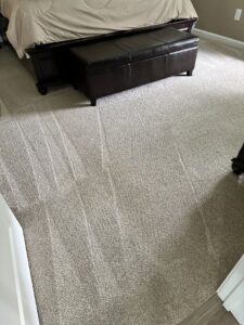 Freshly cleaned bedroom carpet with visible vacuum lines, showcasing the results from Carpet & Rug Cleaning in Mount Pleasant, SC.