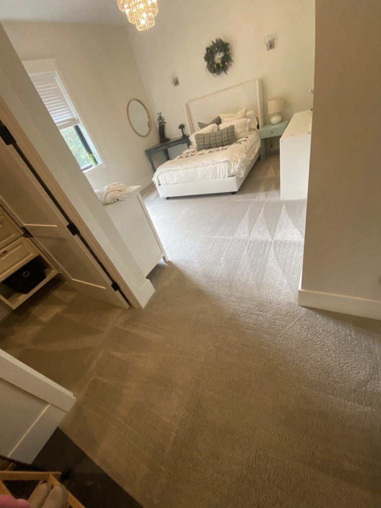 Freshly cleaned carpet with distinct patterns in a bedroom by Greener Carpet Cleaning in Vancouver, WA.