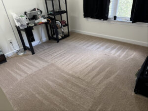 A bedroom with freshly cleaned carpet showing distinct cleaning patterns by Heaven's Best Carpet Cleaning in Concord, NC.