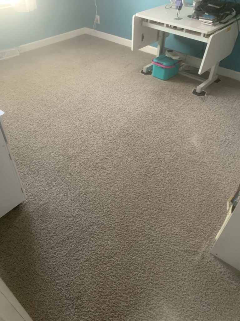 A bright and clean bedroom carpet, showcasing the excellent results of Rhode Island Kwik Dry's services in Rhode Island.