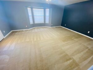 A bedroom with freshly cleaned carpet showing distinct vacuum lines by Pueblo's Best Carpet & Air Duct Cleaning in Pueblo West, CO.