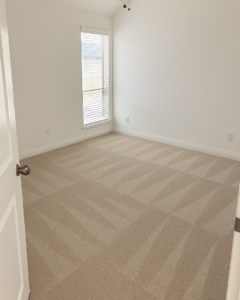 A bedroom with freshly cleaned carpet showing distinct cleaning lines by Stain Punishers Carpet Cleaning in Plano, TX.