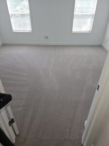 A freshly cleaned carpet with visible vacuum lines in an empty room by Right & Clean Atlanta 24-7 Carpet Cleaning in Atlanta, GA.