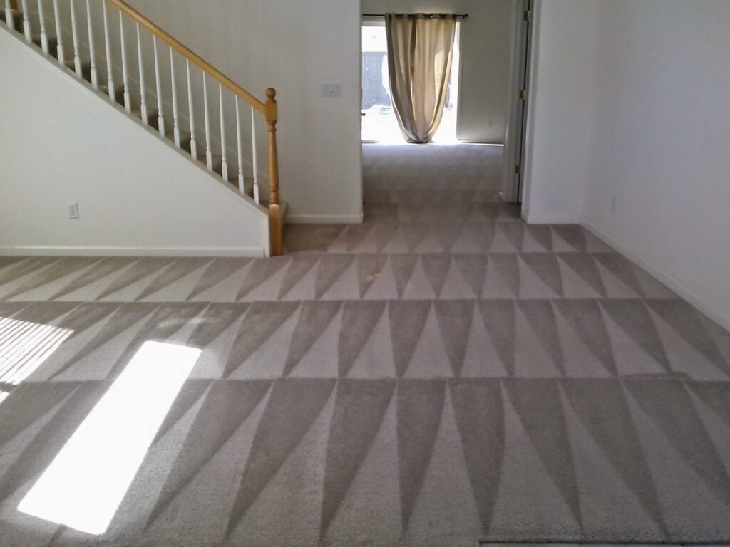 Freshly cleaned carpet with distinct vacuum lines in a hallway by GoldCoast Carpet & Tile Care in Sacramento, CA.