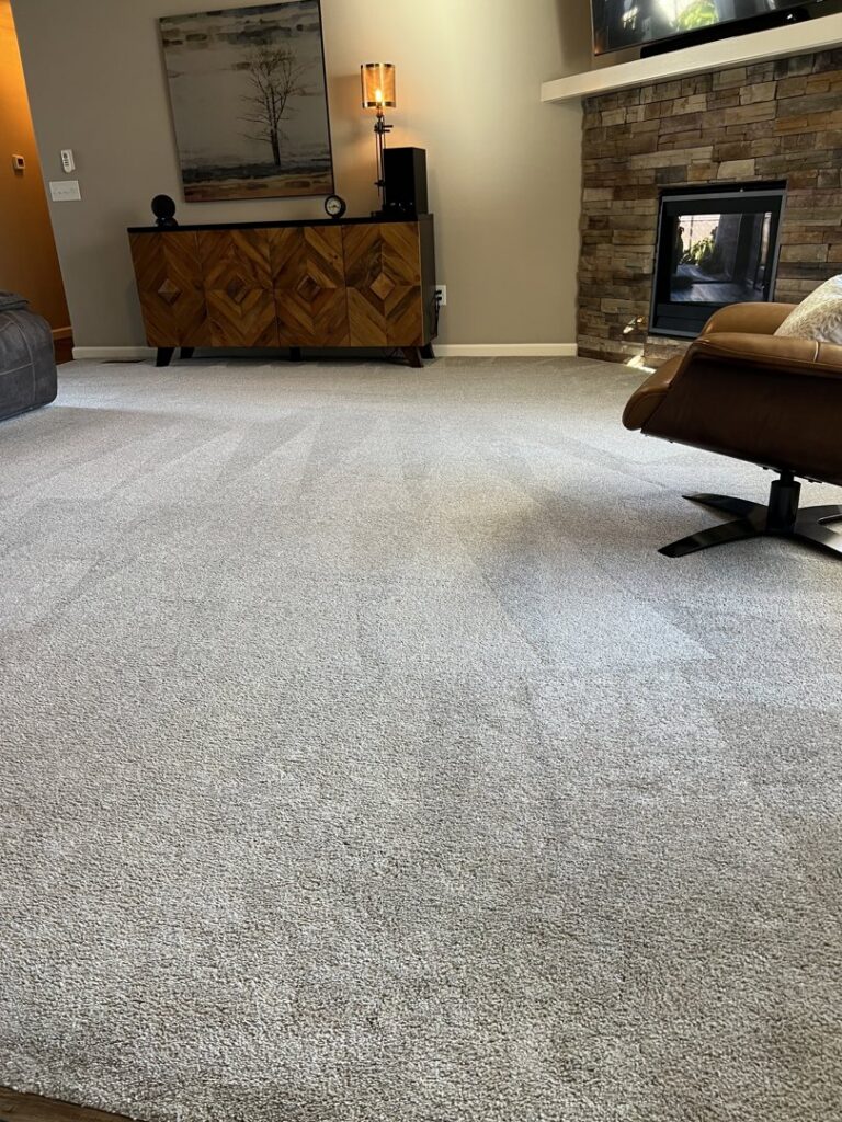 A freshly cleaned carpet in a residential living room by Alpha Clean, a carpet contractor in Fort Wayne, IN.