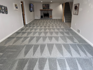 A room with freshly cleaned carpet showing a distinct pattern, completed by Magna-Dry of Lansing, MI.