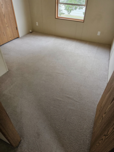 A freshly cleaned carpeted room, showcasing the quality work of Peterson's Carpet & Air Duct Cleaning in Dickinson, ND.