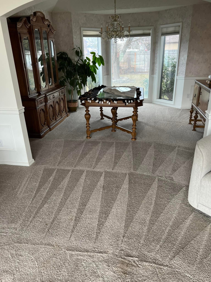 Freshly cleaned carpet with distinct patterns in a dining room, showcasing C & C Carpet Cleaning in Spokane, WA.