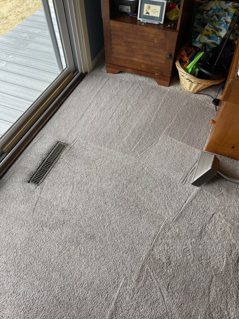 A freshly cleaned carpet showing distinct cleaning lines, indicating professional service by J&P United in Rochester, NY.