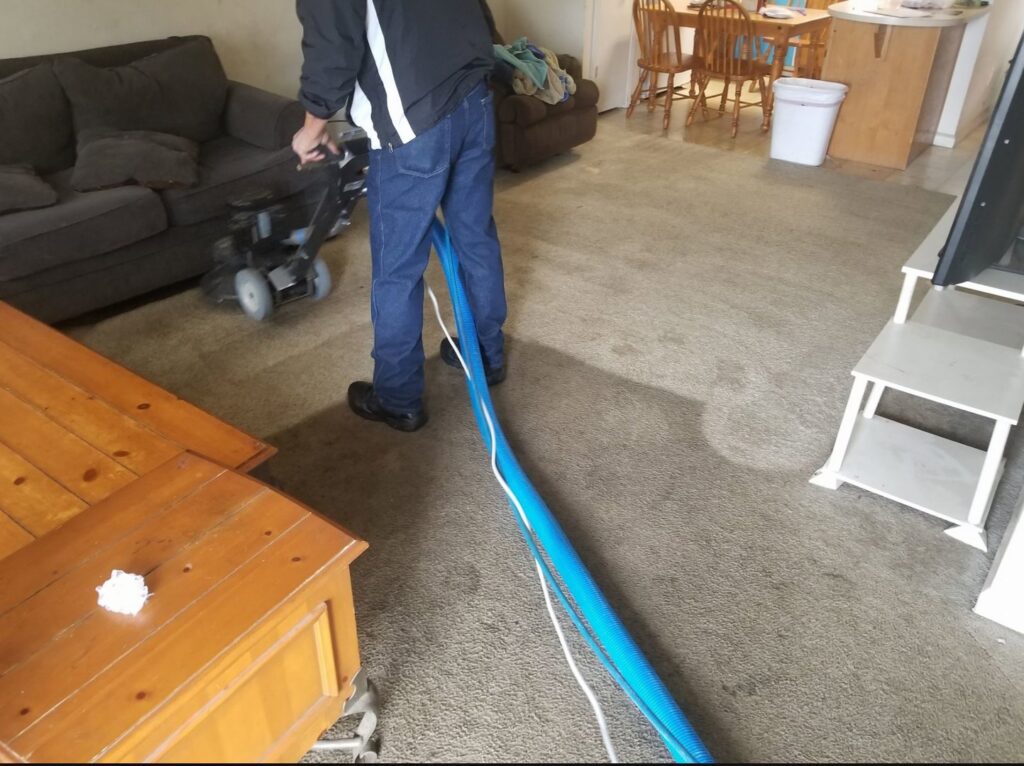 A carpet cleaning wand resting on a freshly cleaned carpet, showing the results of Green Bay Carpet Cleaning in Green Bay, WI.