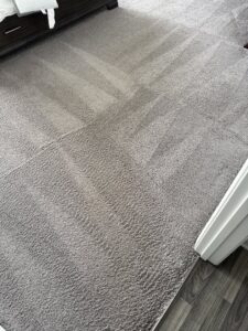 A freshly cleaned gray carpet with visible vacuum lines by Zerorez Greenville, SC.