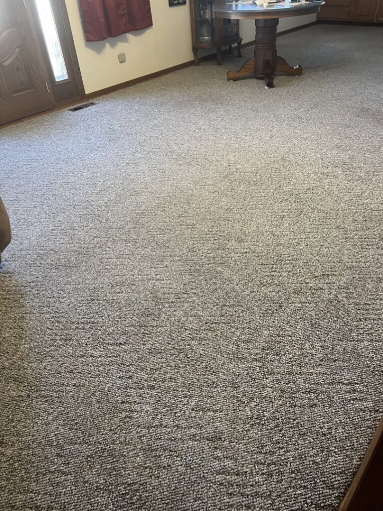 A freshly cleaned carpeted room, showcasing professional results from The Cleaning Connection in Saint Joseph, MO.