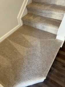 A freshly cleaned carpeted staircase and landing by Treo General Services of North Carolina LLC in Durham, NC.