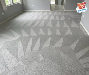A room with freshly cleaned grey carpet showing distinct cleaning patterns by Heaven's Best Carpet Cleaning in Concord, NC.