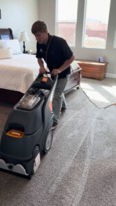 A freshly cleaned light blue carpet in a kitchen and dining area by B's Carpet Cleaning in Saint George, UT.