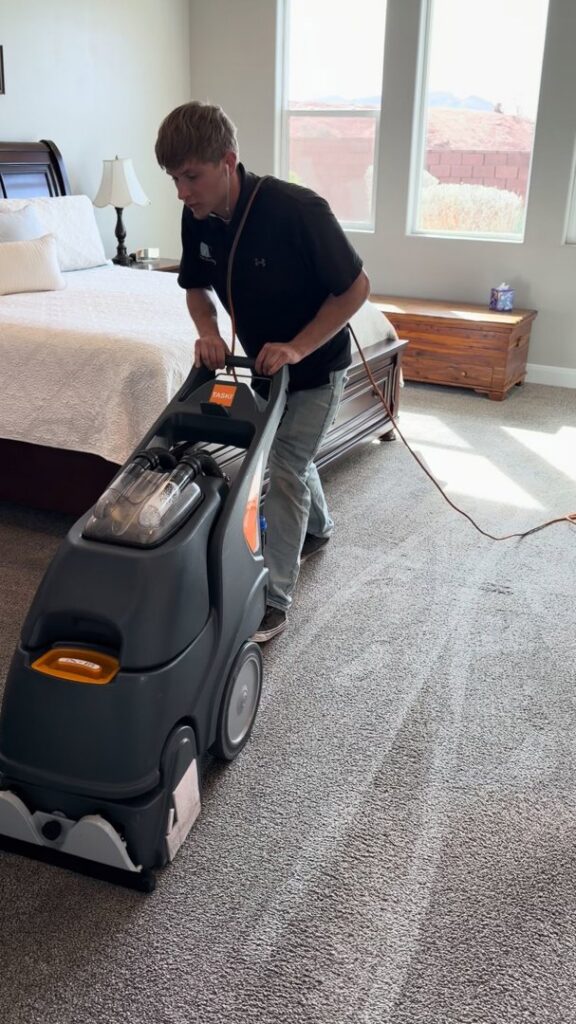 A freshly cleaned light blue carpet in a kitchen and dining area by B's Carpet Cleaning in Saint George, UT.
