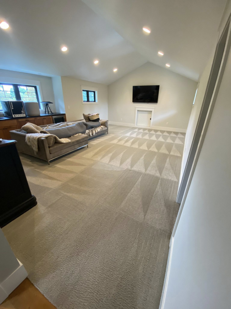 Freshly cleaned carpet with distinct patterns in a living room by Greener Carpet Cleaning in Vancouver, WA.