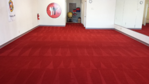A large red commercial carpet freshly cleaned and restored by Awesome Carpets, professional carpet cleaners in Elk Grove, CA.