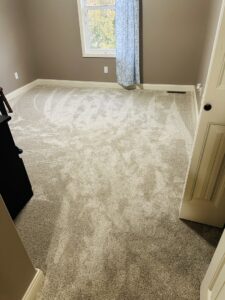 A freshly installed carpet in a bedroom, demonstrating expert carpet services by Floor Boss Peoria in Peoria, IL.
