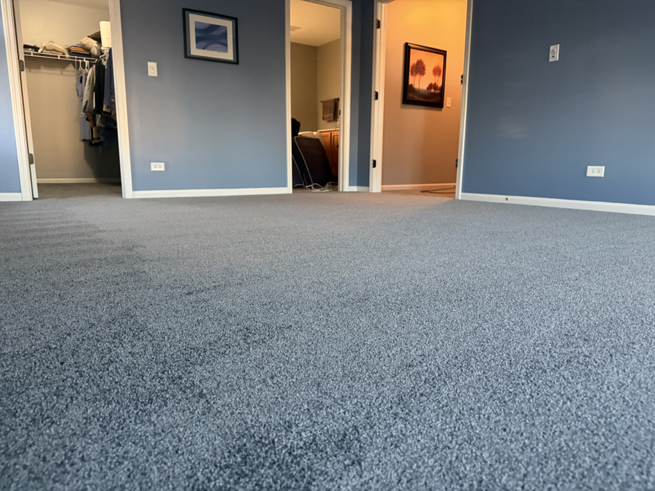 A room showcasing freshly installed blue-grey carpet, expertly done by Carpet Near Me in Services Available In.
