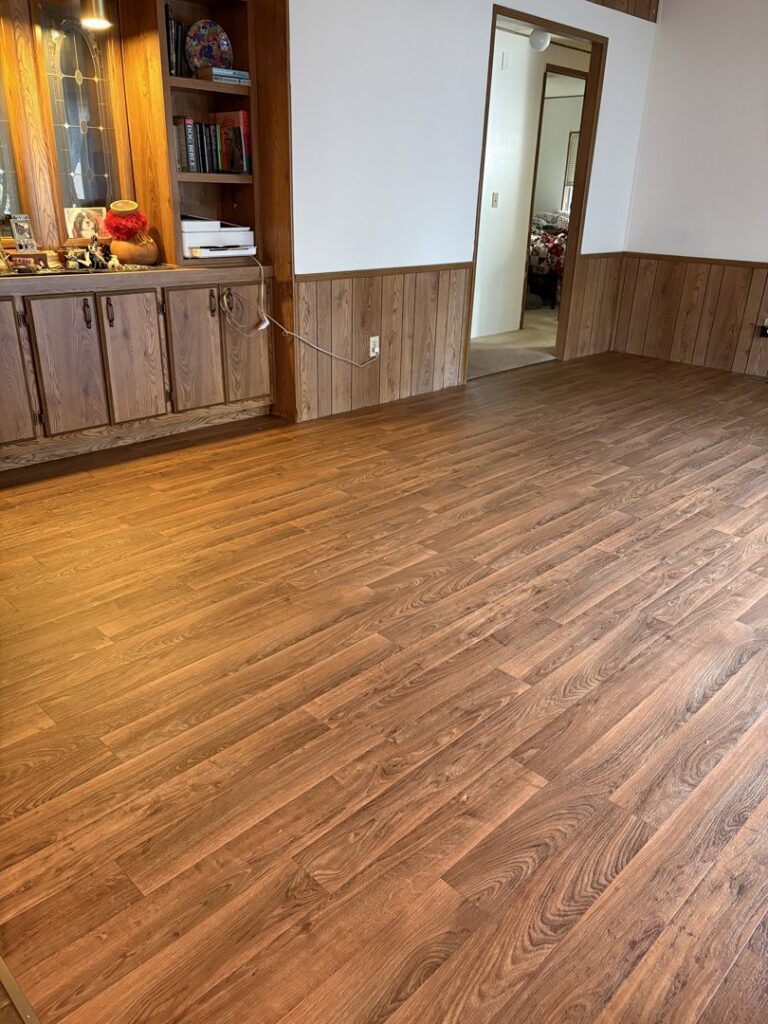 Freshly installed gray carpet in a bedroom, showcasing quality work by Carpet USA in Vancouver, WA.