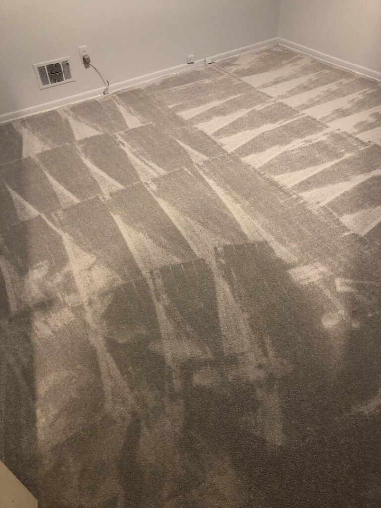 A room featuring freshly installed grey carpet with visible patterns, a quality carpet contractor job by Judkins Carpet & Floor Covering in Aurora, CO.