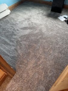 A room featuring freshly installed grey carpet by the expert team at Centennial Carpet & Flooring in Mitchell, SD.