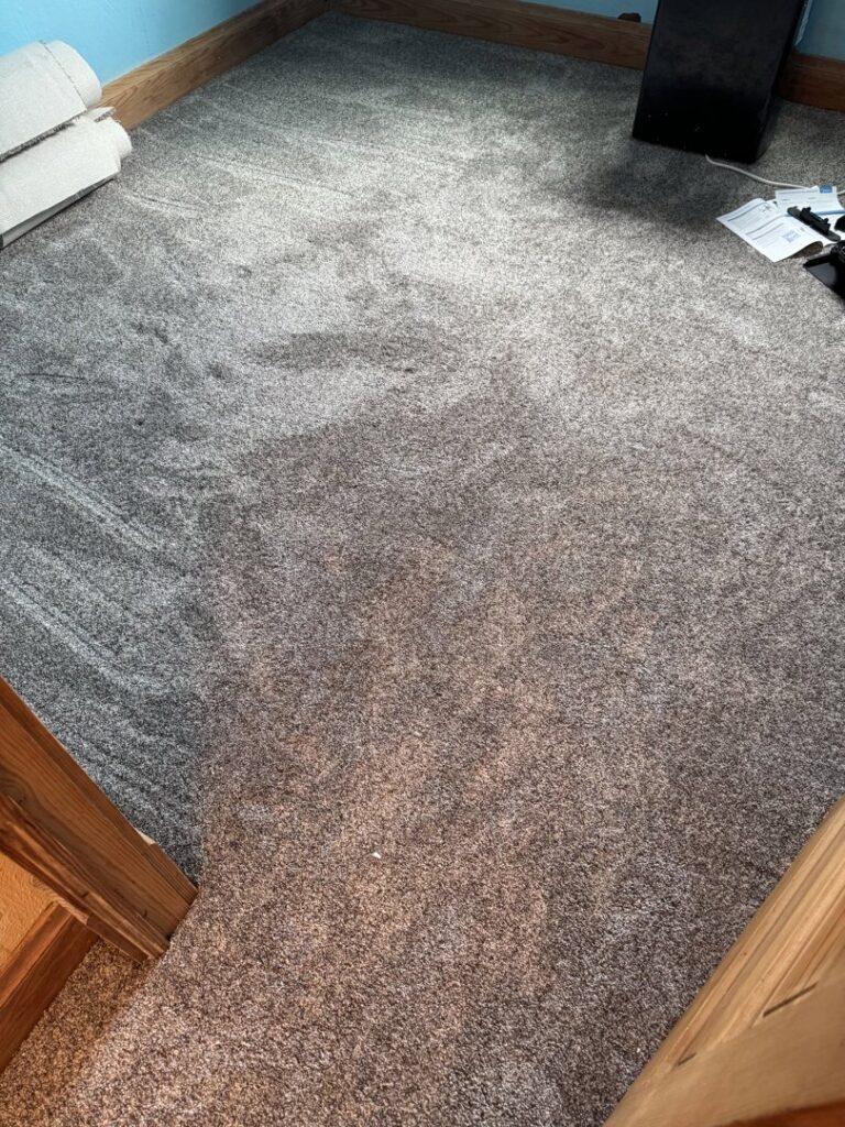 A room featuring freshly installed grey carpet by the expert team at Centennial Carpet & Flooring in Mitchell, SD.