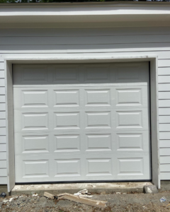 A freshly installed white garage door, showcasing quality work by J&C Bravo LLC for homes in Cordova, TN.