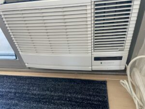 A Friedrich window AC unit installed, showcasing services by Ultimate Air Conditioning in Pearl City, HI