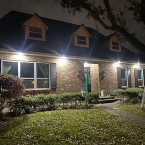 Front of house lighting installation showcasing bright illumination by Light of the World Electric in Lake City, FL.