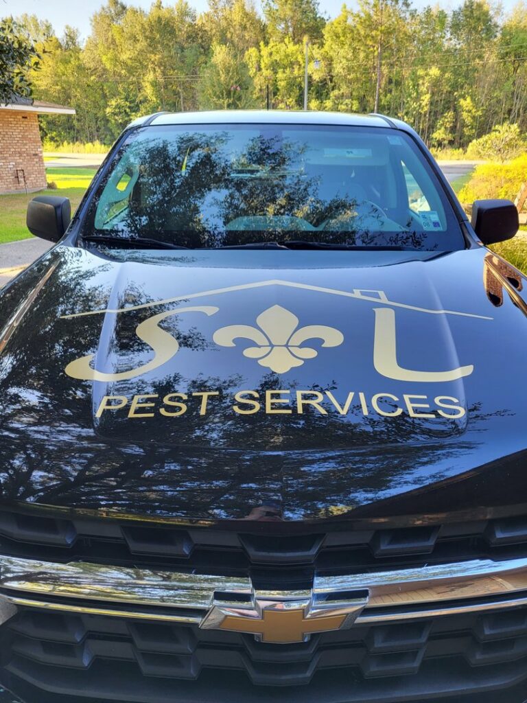 Front view of a branded pest control truck for S&L Pest Services, LLC, ready to serve clients in New Orleans, LA.
