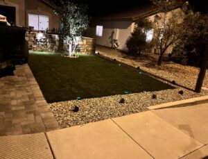 Beautiful front yard with artificial turf and landscape lighting installed by AZ Hardscape & Landscape LLC in Phoenix, AZ.
