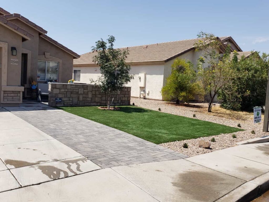 Front yard landscape featuring artificial turf and decorative pavers by AZ Hardscape & Landscape LLC in Phoenix, AZ.