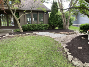 Front yard with fresh mulch and landscaping by Sonner And Sons Lawncare in Fort Wayne, IN.