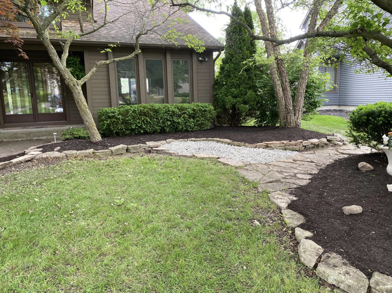 Front yard with fresh mulch and landscaping by Sonner And Sons Lawncare in Fort Wayne, IN.