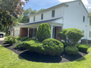 Front yard shrubs before trimming and mulching by Sonner And Sons Lawncare in Fort Wayne, IN.