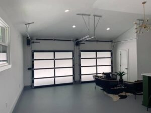 Interior view of two modern garage doors with frosted glass panels installed by Northern Door Company in Murfreesboro, TN