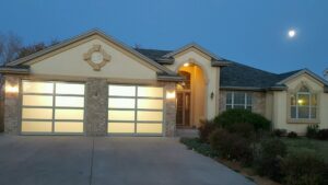 Two modern garage doors with frosted glass panels installed by Prutch's Garage Door in Page, AZ