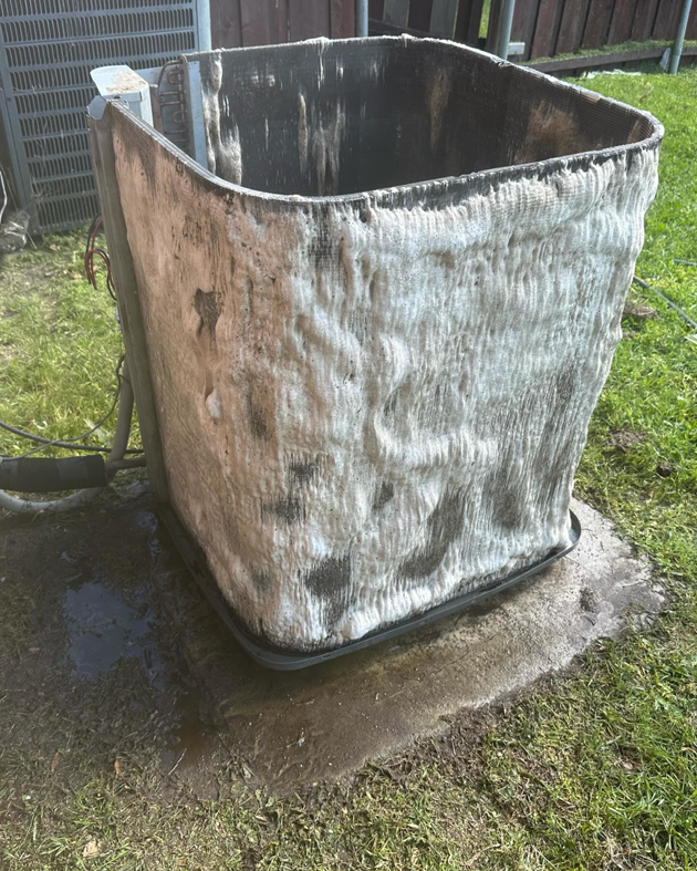 A severely frozen AC condenser unit requiring urgent repair from CLM Mechanical in Dallas, TX